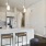 a kitchen with a bar and stools