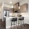 a kitchen with a dining table and chairs