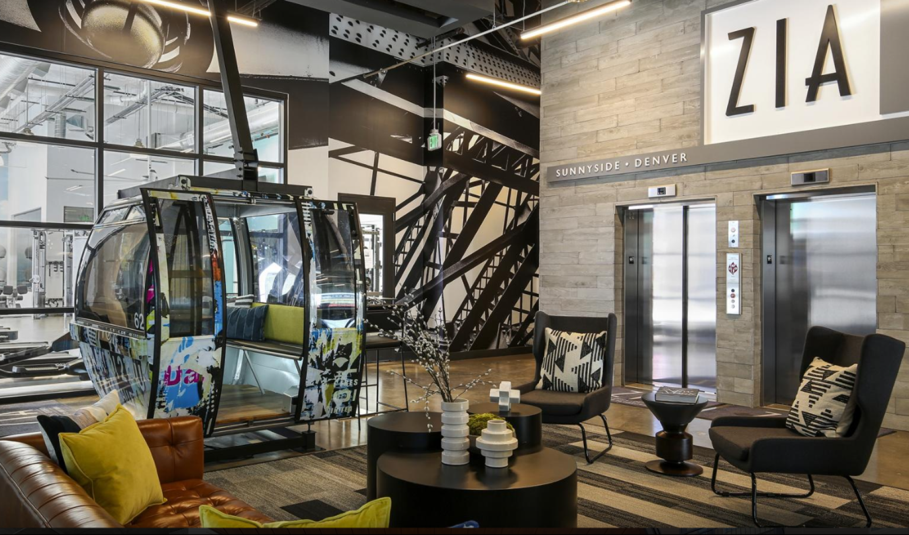 Industrial chic lobby featuring a repurposed gondola car.