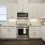 a kitchen with white cabinets