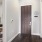 a bedroom with a wood floor