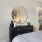 a bedroom with a large mirror