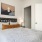a bedroom with a bed and lamps