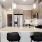 a kitchen with a bar and chairs