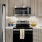 a kitchen with a stove and microwave