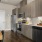 a kitchen with wooden cabinets