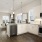 a kitchen with white cabinets