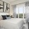 a bedroom with a large window