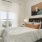 a bedroom with a large window