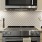 a kitchen with a stove and oven