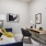 a living room with a desk and couch